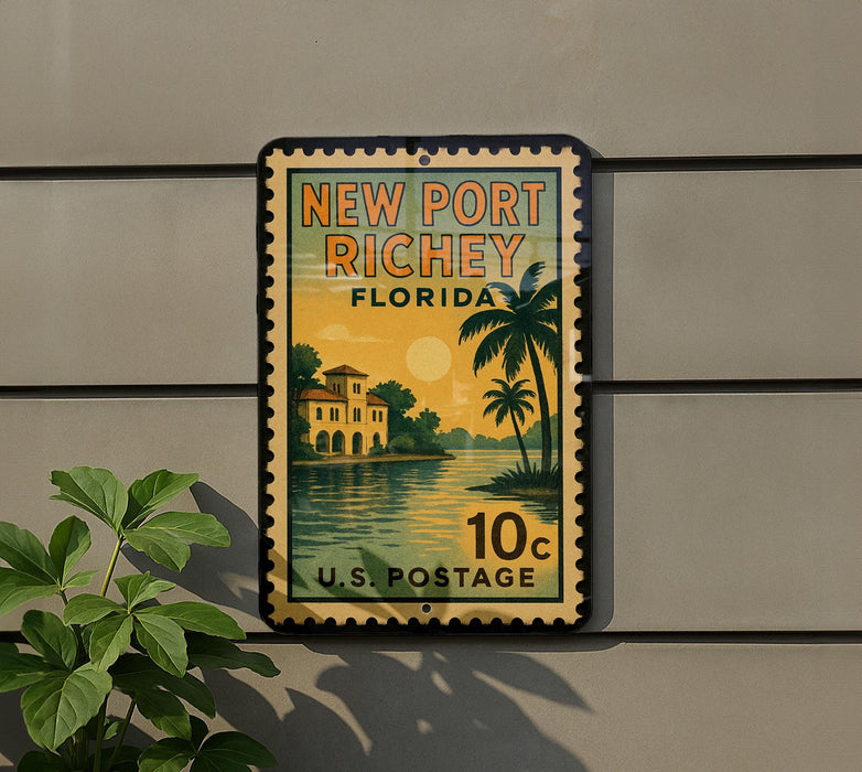 A vintage-style postage stamp from New Port Richey, Florida, featuring a palm tree and a house, mounted on a wall.