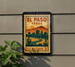 A vintage-style postage stamp depicting the city of El Paso, Texas, with mountains in the background and a desert landscape.