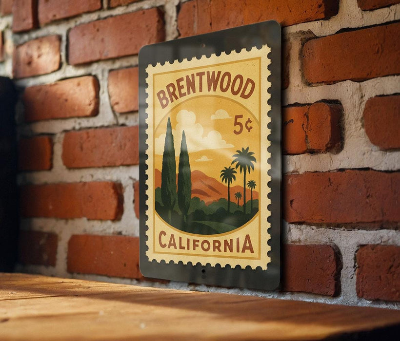 A vintage postage stamp from Brentwood, California, featuring a scenic landscape with palm trees and mountains.