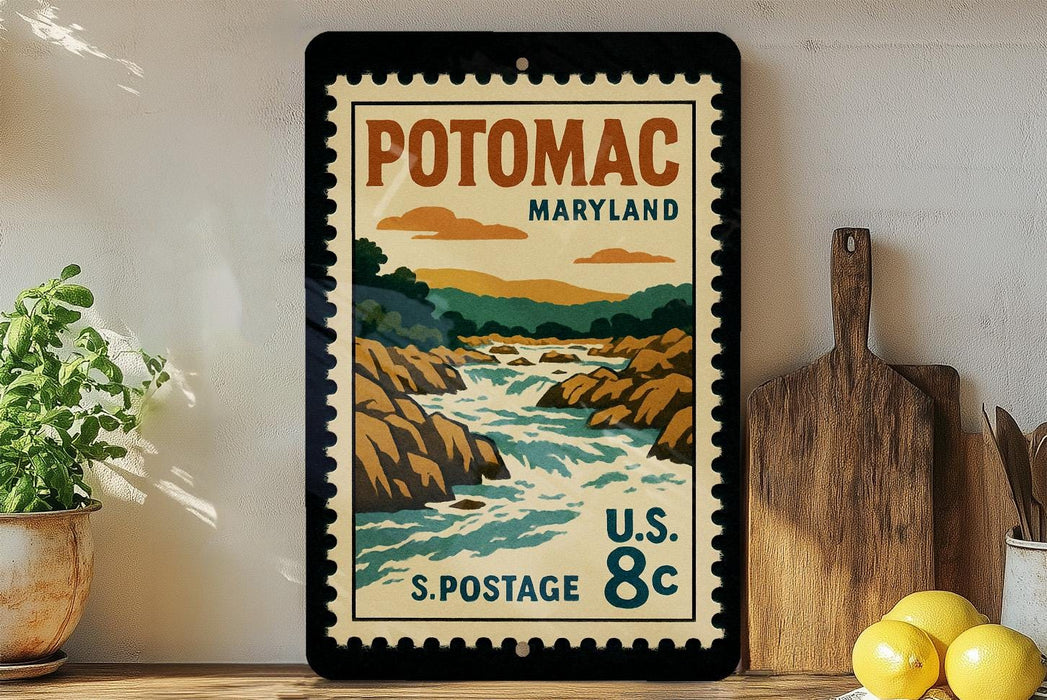 A vintage-style postage stamp from the United States, featuring a scenic landscape of Potomac, Maryland, with a river flowing through the rocky terrain.