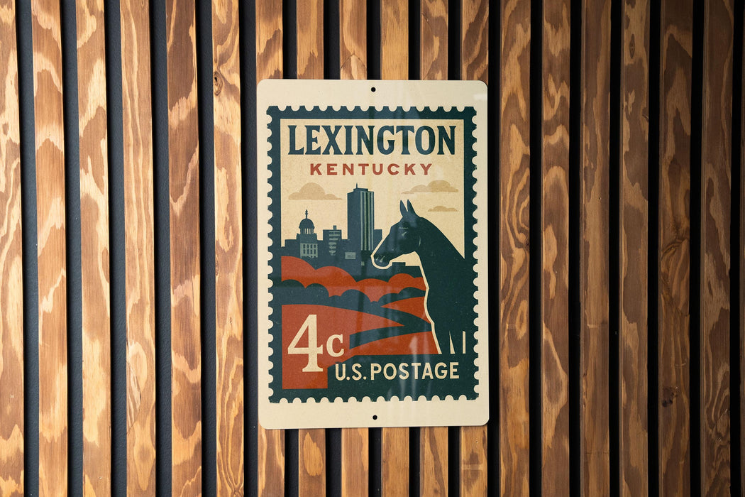 A vintage-style postage stamp from Kentucky, featuring a horse silhouette and a city skyline, is displayed on a wooden wall.
