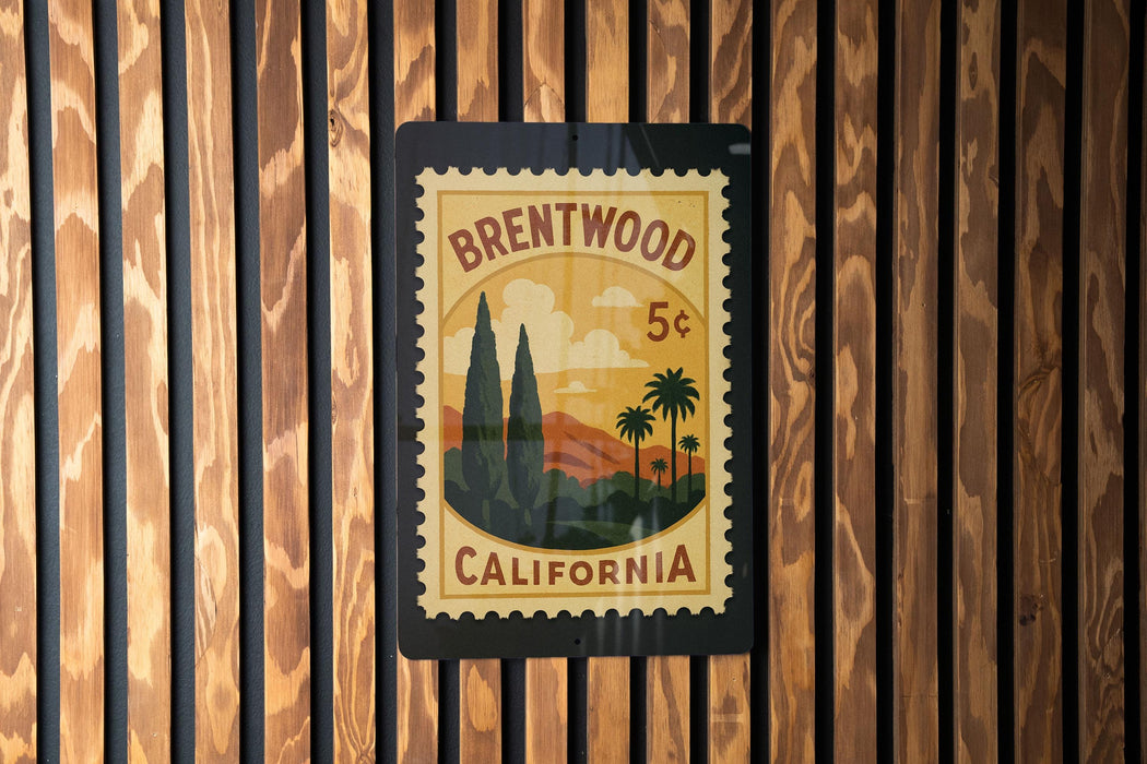 A vintage postage stamp from Brentwood, California, featuring a landscape with palm trees and mountains.