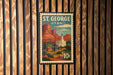 A postage stamp from St. George, Utah, featuring a scenic landscape with mountains, buildings, and a church.