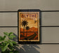 A vintage-style postage stamp from Blythe, California, featuring a palm tree and a desert landscape.