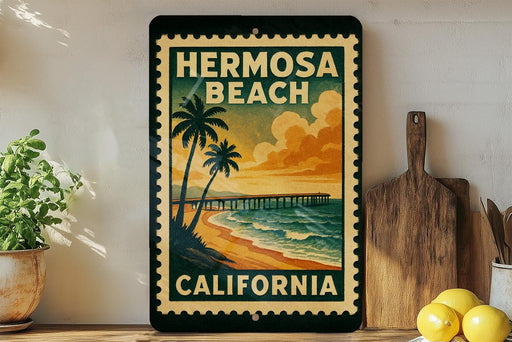A vintage-style metal sign with the text "HERMOSA BEACH CALIFORNIA" and a beach scene with palm trees and a pier.