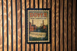 A vintage postage stamp from New Hampshire featuring a waterfall and industrial buildings.