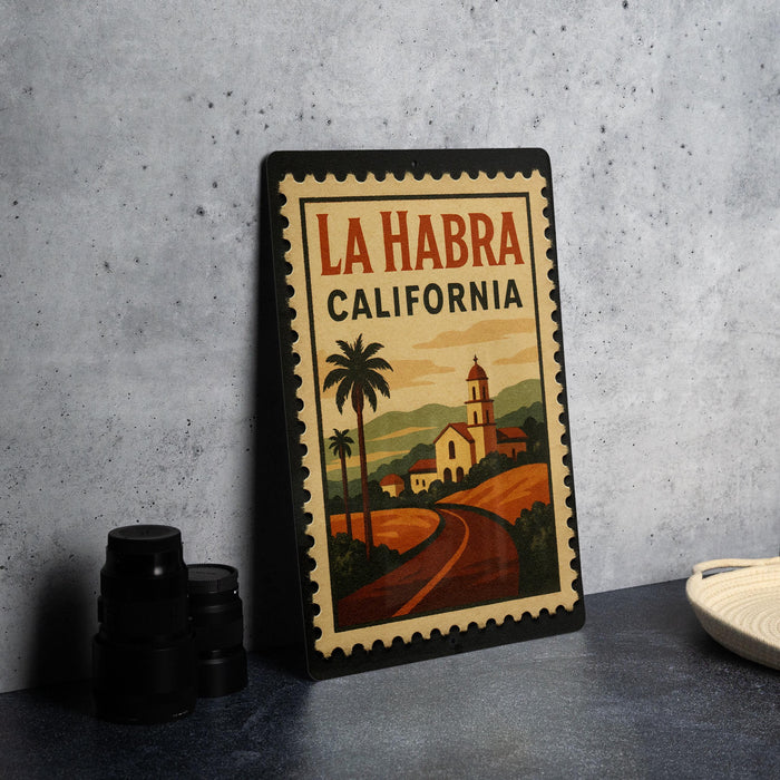 A framed poster of La Habra, California, featuring a scenic illustration of the town and its surroundings.