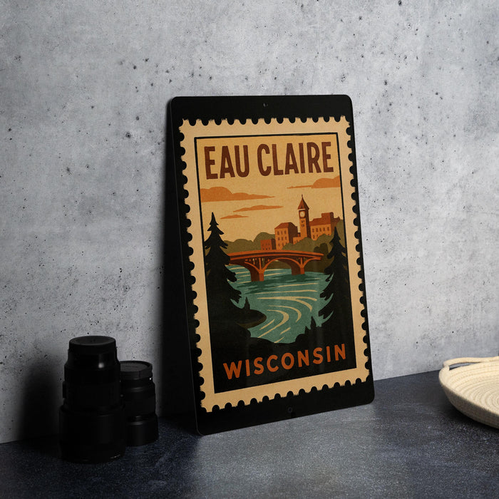 A framed poster of Eau Claire, Wisconsin, featuring a scenic illustration of the town and its river.