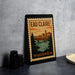 A framed poster of Eau Claire, Wisconsin, featuring a scenic illustration of the town and its river.