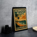 A vintage-style metal sign forHERMOSA BEACH, California, featuring a palm tree and a pier against a sunset backdrop.