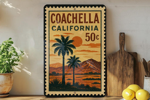 A vintage-style poster of Coachella, California, featuring palm trees and mountains, is displayed on a wall next to a wooden cutting board and a potted plant.