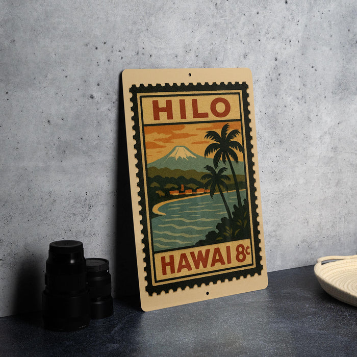 A vintage-style metal sign with a tropical island landscape and a mountain in the background, featuring the text "HILO HAWAII 8c".