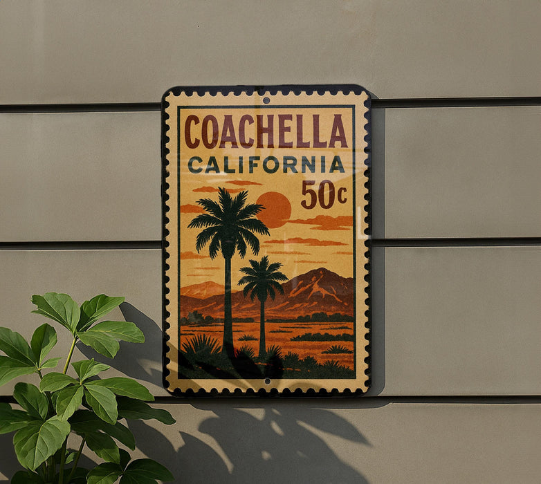 A vintage-style sign for Coachella, California, featuring a palm tree and a sunset landscape.
