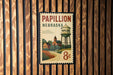 A vintage-style postage stamp from Nebraska featuring a water tower and a rural landscape.