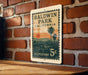 A vintage postage stamp from Baldwin Park, California, featuring a palm tree and sunset landscape.