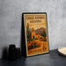 A vintage U.S. postage stamp depicting a desert scene with a building and cacti, placed on a countertop next to some black camera lenses.