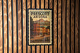 A vintage U.S. postage stamp from Prescott, Arizona, featuring a building and mountains in the background.
