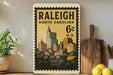 A vintage postage stamp from Raleigh, North Carolina, depicting the city skyline, with a price of 6 cents.