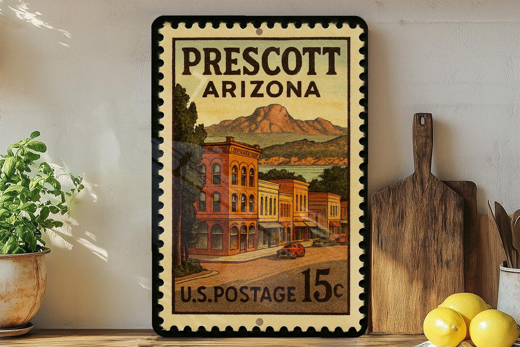 A framed vintage postage stamp from Prescott, Arizona, depicting a street scene with buildings and mountains in the background.