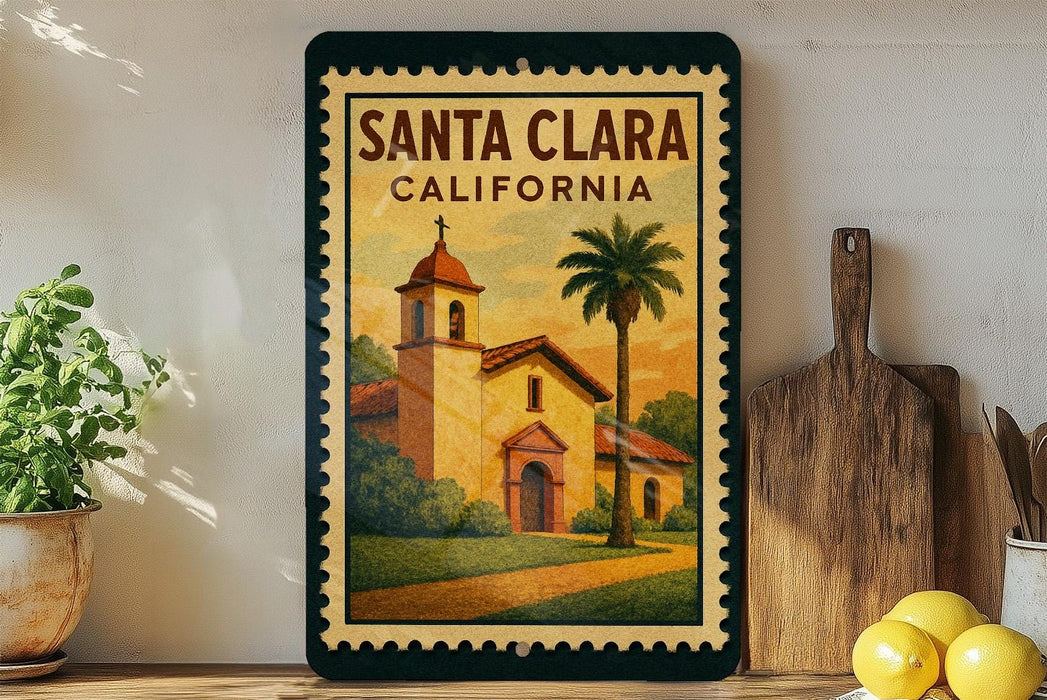 A framed poster of Santa Clara, California, featuring a church and palm trees, is displayed on a wall next to a wooden cutting board and a potted plant.