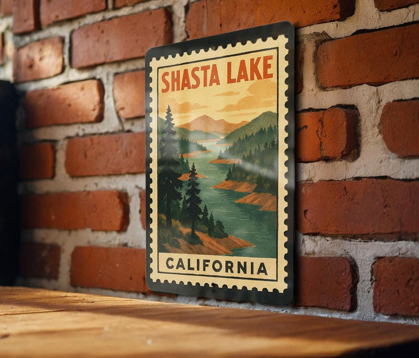 A vintage-style metal sign with the text "SHASTA LAKE CALIFORNIA" is displayed on a brick wall.
