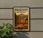 A postage stamp from the United States of America, featuring an illustration of a small town in Arizona with buildings and a road.