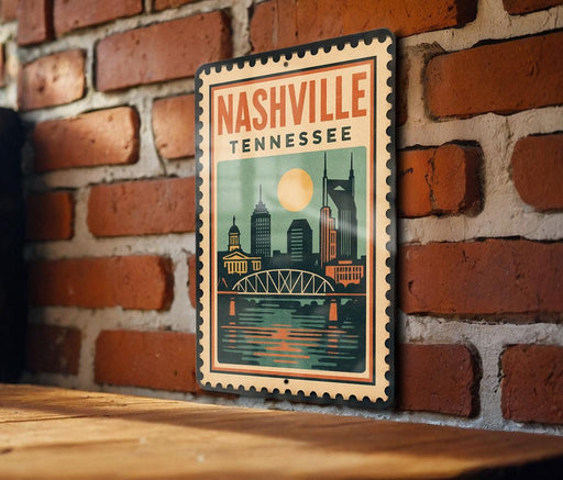 A vintage-style metal sign with the text "NASHVILLE TENNESSEE" displayed on a brick wall.
