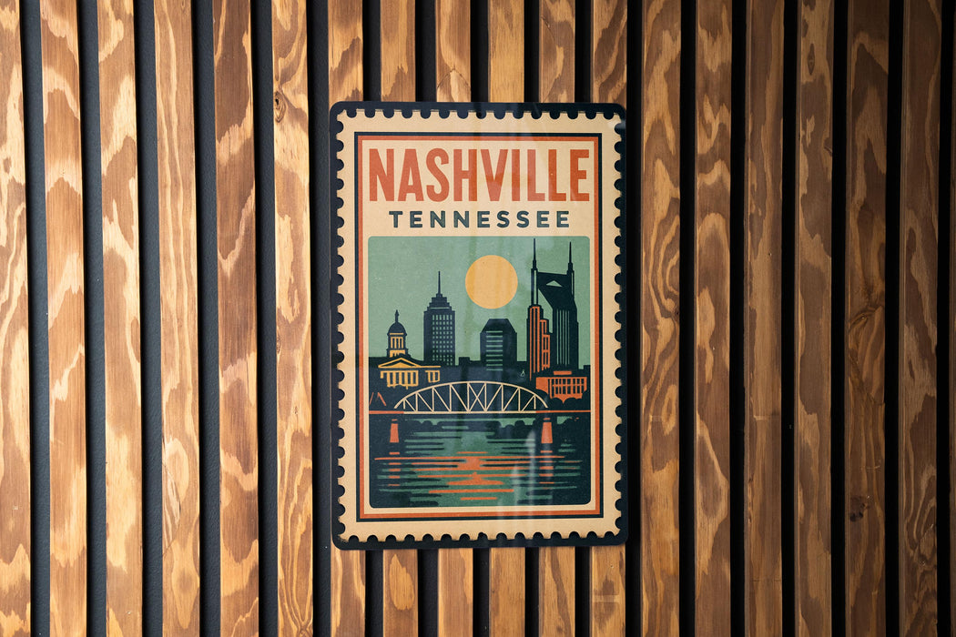 A vintage-style postage stamp from Nashville, Tennessee, featuring a cityscape with a bridge and a large sun in the sky.