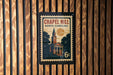 A vintage-style postage stamp from Chapel Hill, North Carolina, featuring a church steeple and a clock tower.