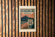 A sign for Kingman Arizona Route 66 is displayed on a wooden wall.
