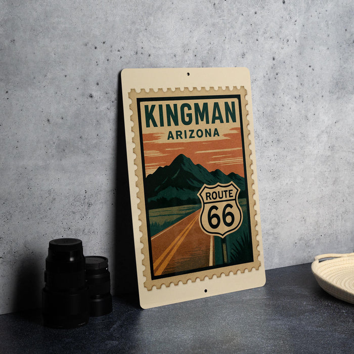 A metal sign with a vintage-style illustration of Route 66 in Arizona, featuring mountains and a road.