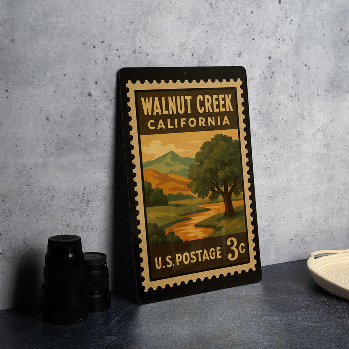 A vintage-style metal stamp depicting Walnut Creek, California, with a landscape scene and text indicating it is a postage stamp from the United States Postal Service.