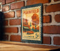 A vintage postage stamp from Illinois, featuring a brick building and a tree, is displayed on a brick wall.