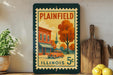 A vintage postage stamp from Illinois, featuring a colorful illustration of a town scene with a car and a church.