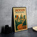 A vintage-style metal stamp depicting the city of Jackson, Mississippi, with a road leading to the state capitol building.