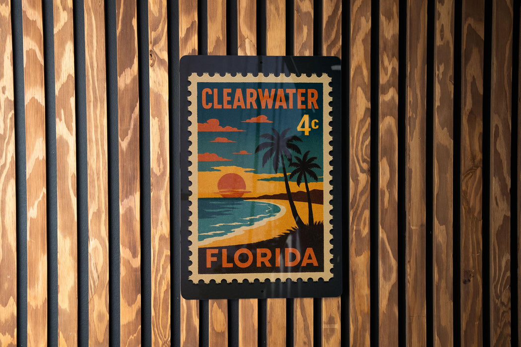 A vintage-style postage stamp from Florida, featuring a beach scene with palm trees and a sunset, is displayed on a wooden wall.