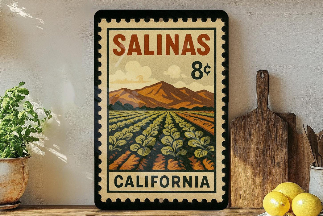 A framed vintage postage stamp depicting a farm scene in California, with mountains in the background and a field of crops in the foreground.