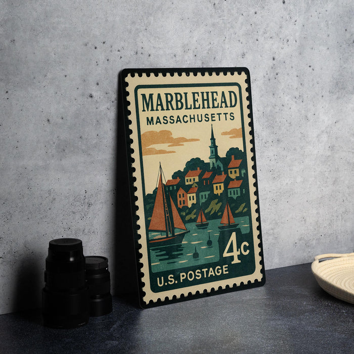 A vintage-style postage stamp from Marblehead, Massachusetts, featuring a sailboat and a town scene.