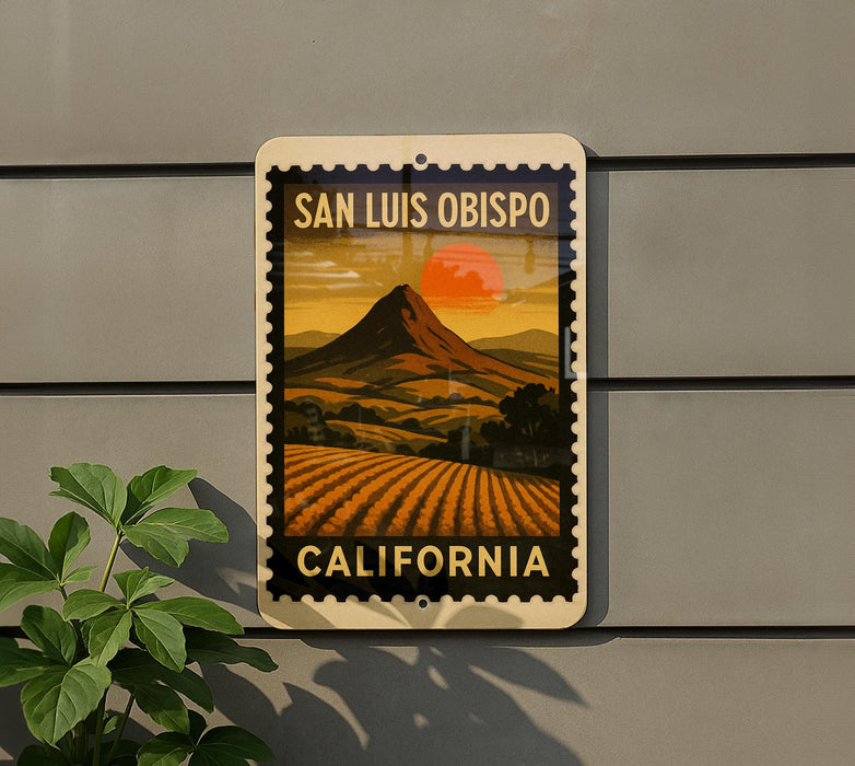 A vintage-style poster of San Luis Obispo, California, featuring a mountain landscape with a sunset in the background.