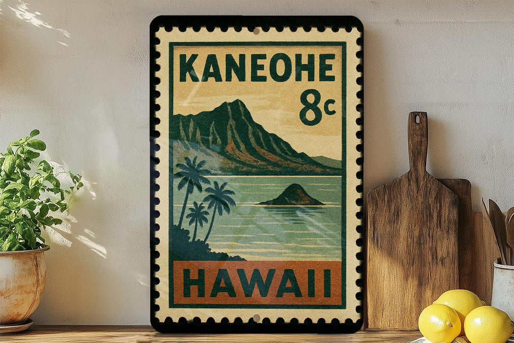 A vintage-style stamp depicting a tropical island landscape with palm trees and mountains, along with the text "KANEOHE 8c HAWAII" printed on it. The stamp is displayed on a shelf next to a wooden cutting board and a potted plant.