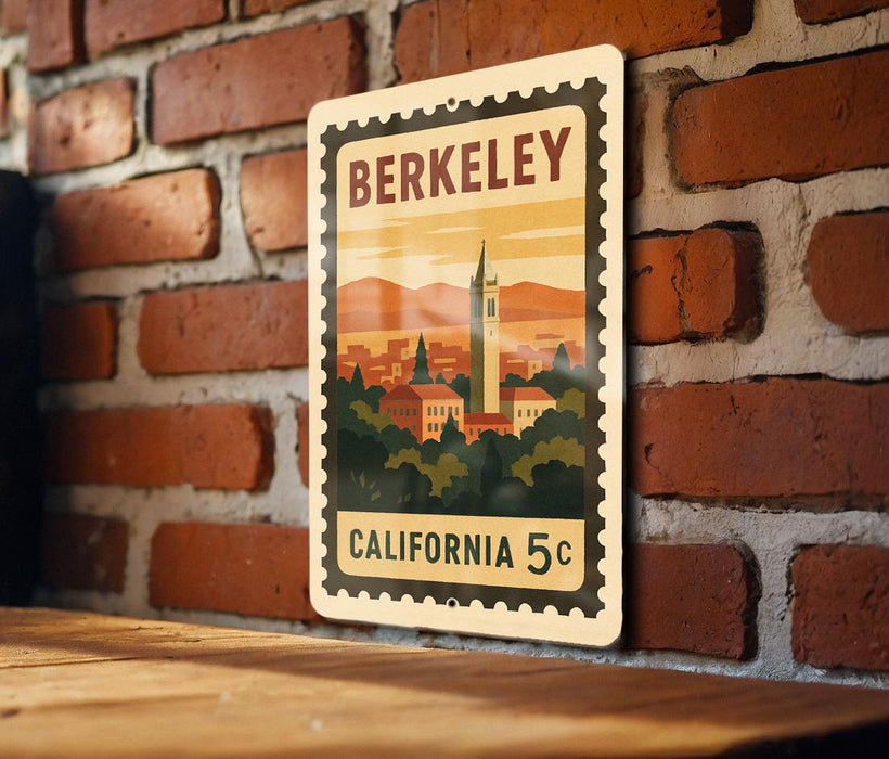 A vintage-style metal stamp depicting the Berkeley skyline, with a clock tower and surrounding buildings, is mounted on a brick wall.