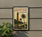A postage stamp depicting a lighthouse and palm trees, with the text "JUPITER FLORIDA" and "U.S. POSTAGE 5c" printed on it.