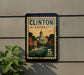 A vintage-style sign for Clinton, Mississippi, with a postage stamp design and the text "CLINTON MISSISSIPPI 5 CENTS".