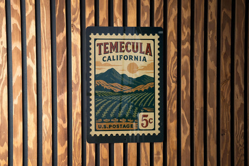 A vintage postage stamp from Temecula, California, featuring a mountainous landscape and a sun in the sky.