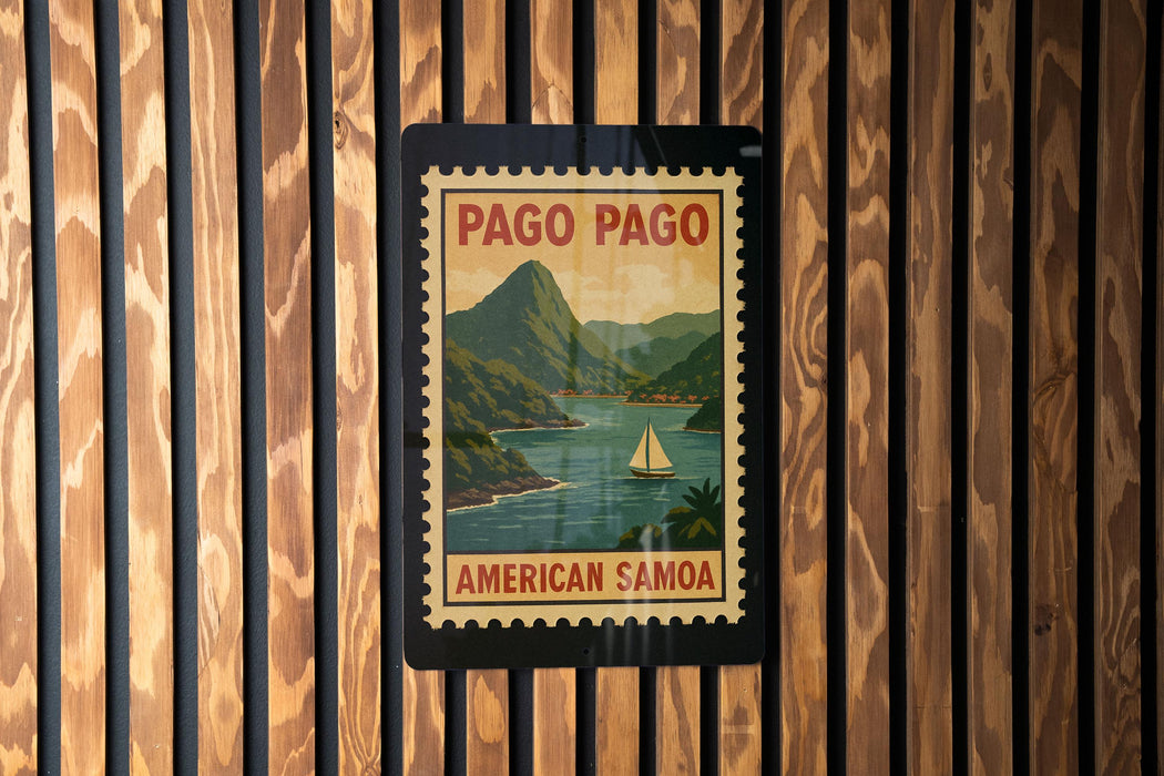 A vintage-style postage stamp depicting a scenic landscape with mountains, a river, and a sailboat, hanging on a wooden wall.