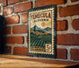 A vintage-style metal stamp depicting a scenic landscape of Temecula, California, with mountains, fields, and a sun in the sky.