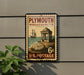 A vintage postage stamp from Plymouth, Massachusetts, featuring a sailing ship and a historic building, mounted on a wall.