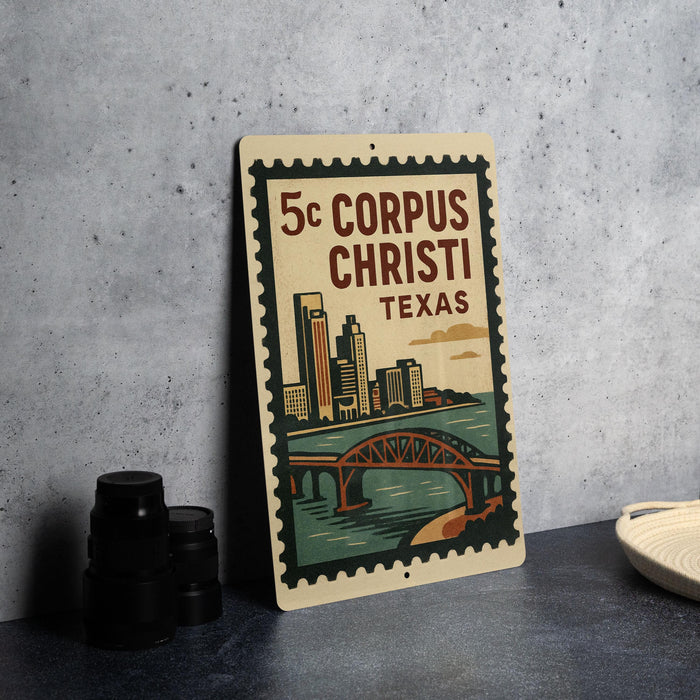 A vintage-style metal sign with a cityscape and a bridge, featuring the text "5c CORPUS CHRISTI TEXAS" on it.