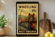 A vintage-style stamp depicting a bridge in West Virginia, with the text "WHEELING 10c WEST VIRGINIA" printed on it. The stamp is displayed on a shelf next to a wooden cutting board and a potted plant.