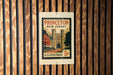 A vintage Princeton New Jersey postage stamp is displayed on a wooden wall.